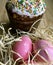 Easter cake paska in straw and the coloured eggs krashanka