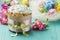 Easter cake, pink flowers and painted eggs