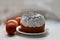 Easter cake is watered with white glaze and sprinkled with poppy seeds on top. Three brown chicken eggs dyed with onion skins. Clo