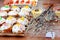 Easter cakes, willow branches, Easter curd on the background of eggs and woman hand. Consecration of festive food with Holy water