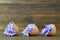 Easter card with Easter flowers in eggshells on wooden table