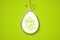 Easter celebrate banner with golden easter egg and handwritten holiday wishes of a Happy Easter on green background.