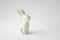 Easter ceramic rabbit figurine on a white background