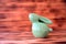 Easter ceramic rabbit on wooden background one.
