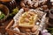 Easter cheesecake with peach and passion fruit on festive table