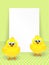 Easter chicks and white blank over dotted background