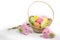 Easter colored eggs in a basket and Easter pink bunnies.