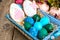 Easter colored eggs, straw, flowers