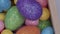 Easter colorful and shining quail eggs rotating and close up. Holiday healthy food concept.