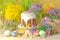 Easter composition with cake, coloured eggs and flowers