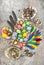 Easter composition colored eggs and birds feather