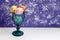 Easter composition. Colored eggs in a cup on a blue background. Concept. Place for text