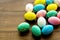 Easter composition. Decorated pastel Easter eggs on dark wooden background copy space