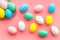 Easter composition. Decorated pastel Easter eggs on pink background