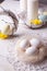 Easter composition, decorative wreaths and nest with white eggs on a wooden table, bright festive morning.