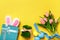 Easter composition. Holiday symbols on yellow background with copy space