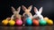 Easter composition with playful rabbits and painted eggs on rustic wooden tabletop