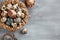 Easter composition - several marble eggs painted with natural dyes in a wicker nest and baskets, top veiw