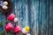 Easter composition - tulips, toy chicken and nest with eggs on wooden background, top view.