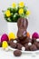 Easter concept - chocolate Easter bunny and colorful eggs