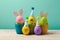 Easter concept with cute handmade eggs in coffee cups, bunny, chicks and party hats