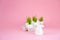 Easter concept with eggs and bunny on a pink background. Eggshell grass, spring, Easter. Festive concept close-up and copy space o