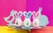 Easter concept. Festive stand for Easter eggs. eggs with painted muzzles and ears made of fabric. Rabbit and chicken