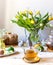 Easter concept. Food composition with easter cake, colour eggs, flowers and easter decoration