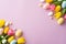 Easter concept. Top view photo of spring flowers bunches of yellow and pink tulips and colorful easter eggs
