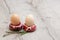 Easter concept. Two donut-shaped handmade ceramic egg holders or cups isolated on table.