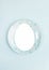 Easter creative festive minimal layout with copy space in egg shape on plate on center of light blue backdrop.