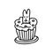 Easter cupcake decorated  a rabbit biscuit doodle.