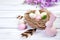 Easter decor with speckled eggs, nest and flowers and bunny