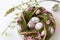 Easter decorated wreath, hen and faucet with easter eggs as decoration. Photo on white background