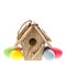 Easter decoration with birdhouse and colorful eggs