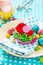 Easter decoration children`s table. Decorating Easter table nest with baby bird paper and candy, chicken and eggs