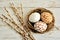 Easter decoration with mosaic eggs and willow twigs on white background.