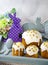 Easter decoration set with glazed kulich and vanilla eclairs