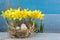 Easter decorations. Eggs in nests on wood