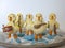 Easter decorations. Musical band of ceramic chicks on tray