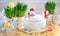 Easter dishes in the form of chickens and rabbits on a white wooden background.
