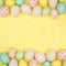 Easter double border with modern farmhouse cloth and pastel eggs over a square yellow wood background