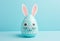 Easter egg with bunny ears on pastel background. Minimalistic creative holiday concept