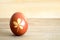 Easter egg colored naturally on wooden background