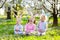 Easter egg hunt. Kids with bunny ears and basket