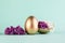 Easter egg painted in gold color decorated with purple lilac floewrs. Happy Easter minimalistic background