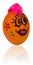 Easter egg, painted in smiling cartoon face of girl. Decorated e