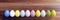 Easter egg row on wood, header. Holiday celebration. Pastel color paint. 3d render