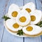 Easter egg-shaped shortbread cookies with apricot jam, sprinkled with powdered sugar.