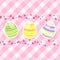 Easter egg and spring flowers on pink gingham
